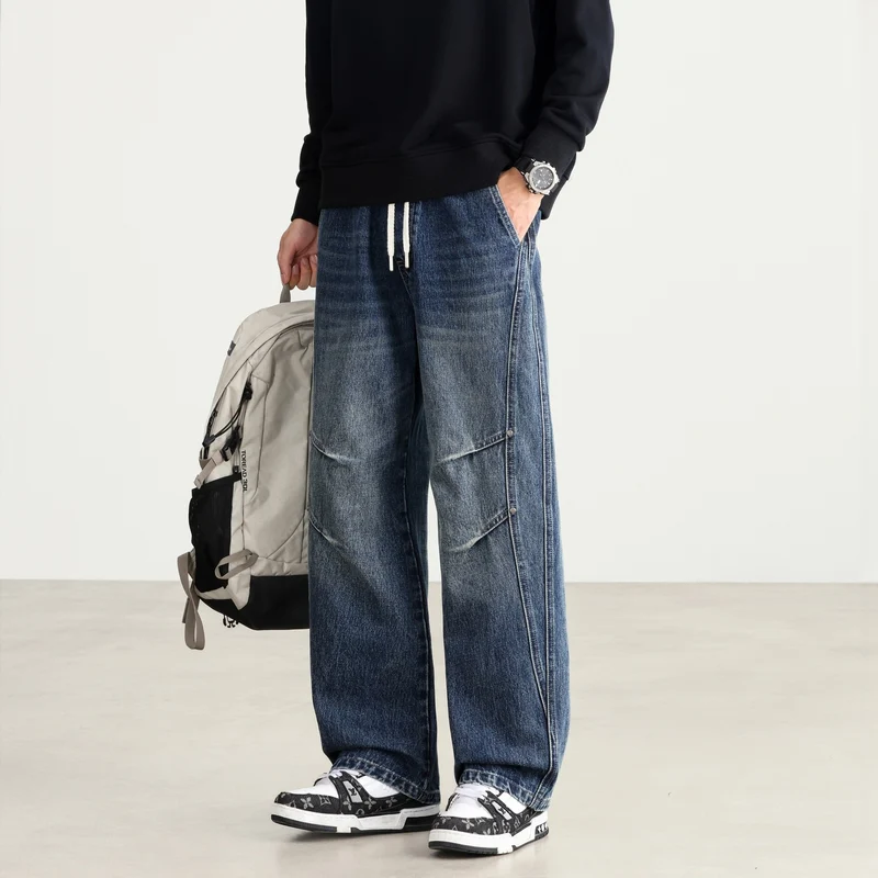Herren Weite Denim-Hose mit Tunnelzugbund, Paneelnähten und Used-Waschung Drune