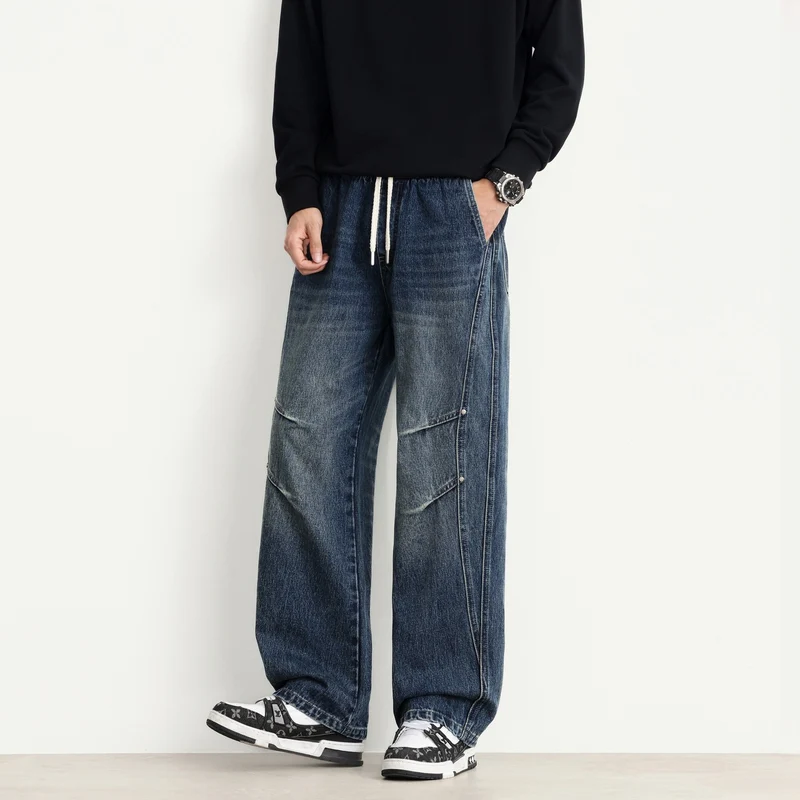 Herren Weite Denim-Hose mit Tunnelzugbund, Paneelnähten und Used-Waschung Drune