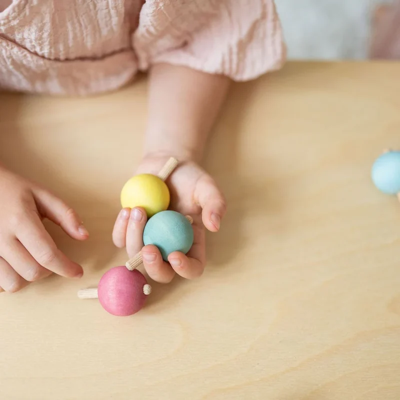 Kleine Kreisel in Pastellfarben | Grimms