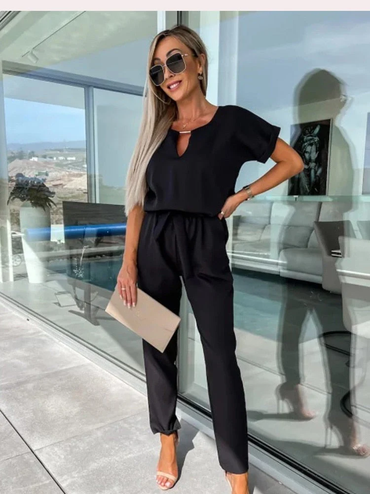 Drune | Eleganter Jumpsuit mit kurzen Ärmeln und Gürtel