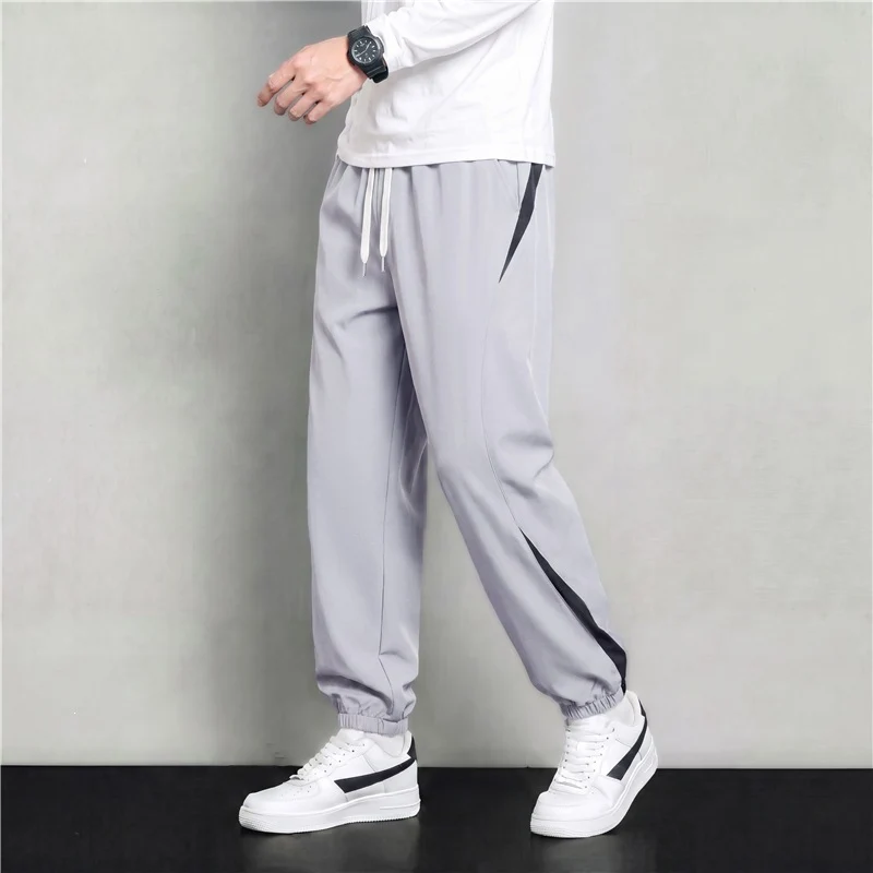 Herren Athleisure Jogginghose im Baggy‑Schnitt mit elastischem Bund, Tunnelzug und seitlichen Kontrastkeilen Drune