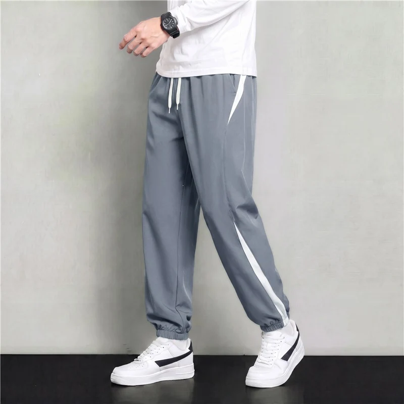 Herren Athleisure Jogginghose im Baggy‑Schnitt mit elastischem Bund, Tunnelzug und seitlichen Kontrastkeilen Drune