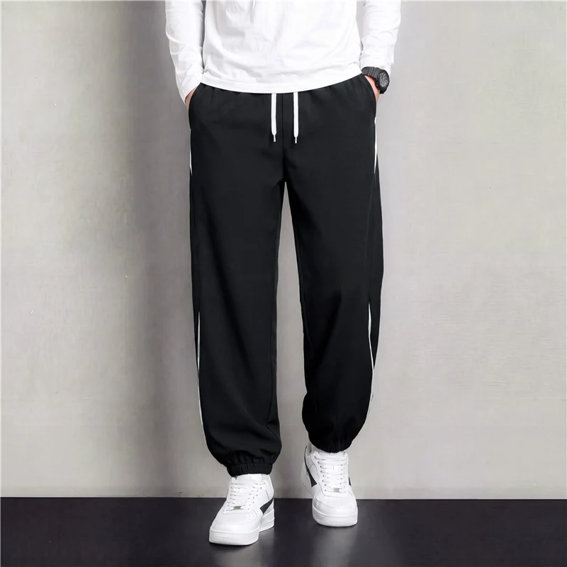Herren Athleisure Jogginghose im Baggy‑Schnitt mit elastischem Bund, Tunnelzug und seitlichen Kontrastkeilen Drune