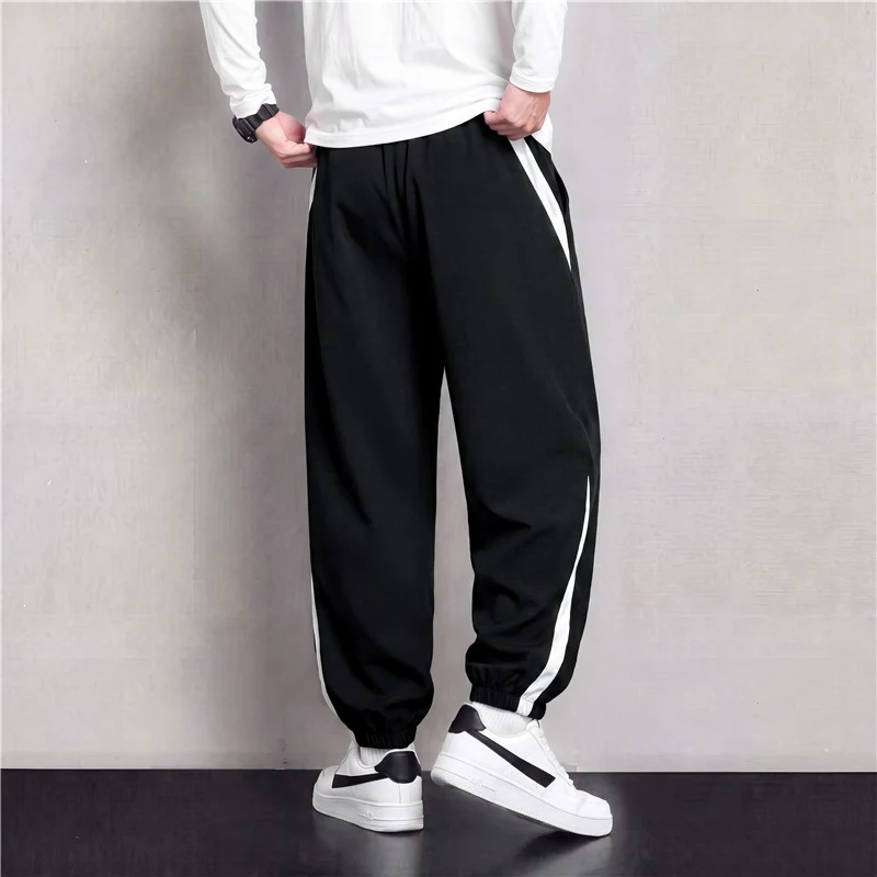 Herren Athleisure Jogginghose im Baggy‑Schnitt mit elastischem Bund, Tunnelzug und seitlichen Kontrastkeilen Drune
