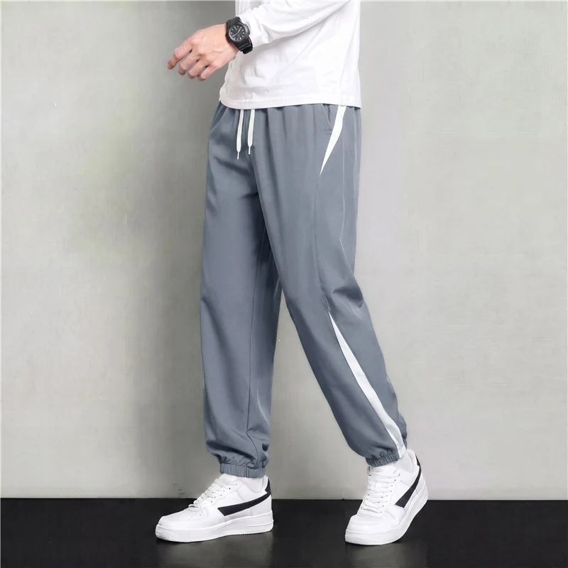 Herren Athleisure Jogginghose im Baggy‑Schnitt mit elastischem Bund, Tunnelzug und seitlichen Kontrastkeilen Drune