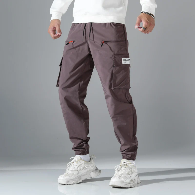 Herren konisch geschnittene Utility-Cargohose im Joggerstil mit Tunnelzugbund, Reißverschlusstaschen & elastischen Beinabschlüssen Drune