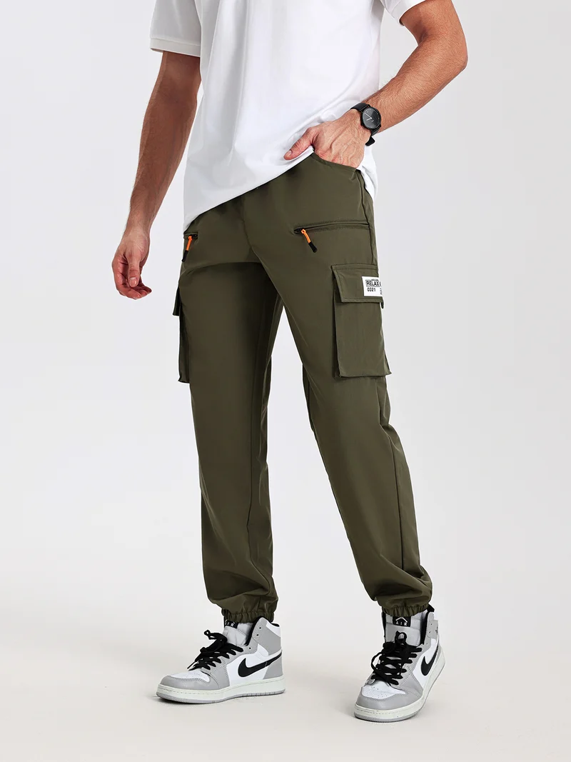 Herren konisch geschnittene Utility-Cargohose im Joggerstil mit Tunnelzugbund, Reißverschlusstaschen & elastischen Beinabschlüssen Drune