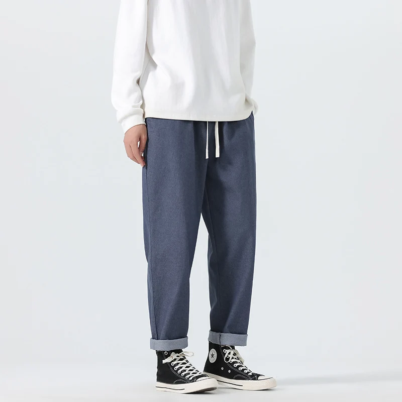 Herren Locker geschnittene Cropped-Denimhose mit Umschlag und Label-Patch Drune