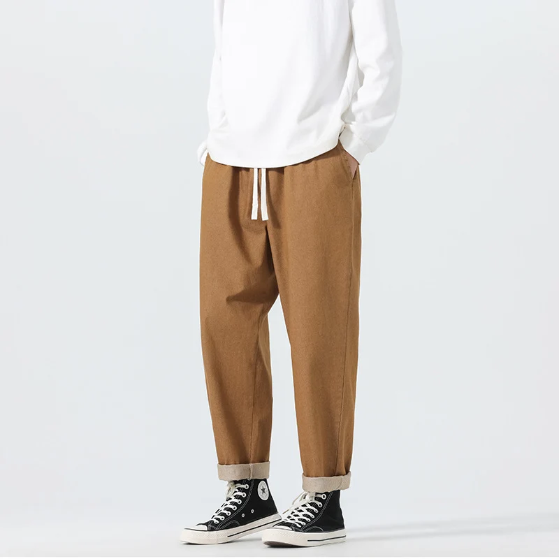 Herren Locker geschnittene Cropped-Denimhose mit Umschlag und Label-Patch Drune