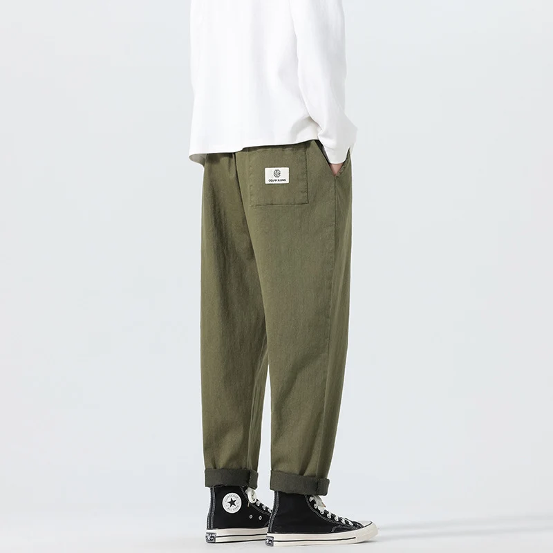 Herren Locker geschnittene Cropped-Denimhose mit Umschlag und Label-Patch Drune