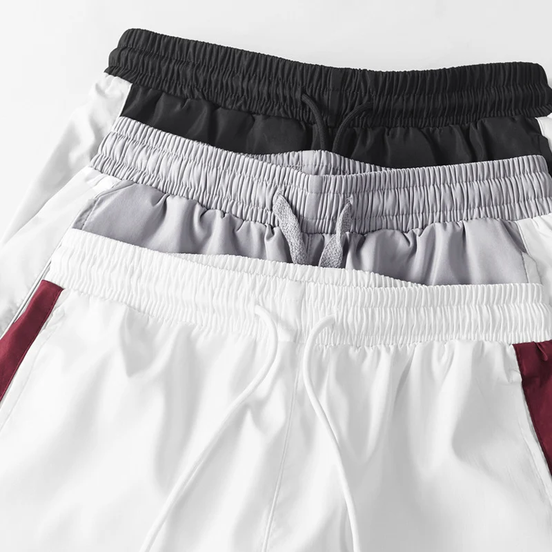 Herren Sportives Freizeit-Trainingsanzug-Set aus leichtem Windbreaker-Material mit Kontraststreifen und reflektierenden Einsätzen Drune