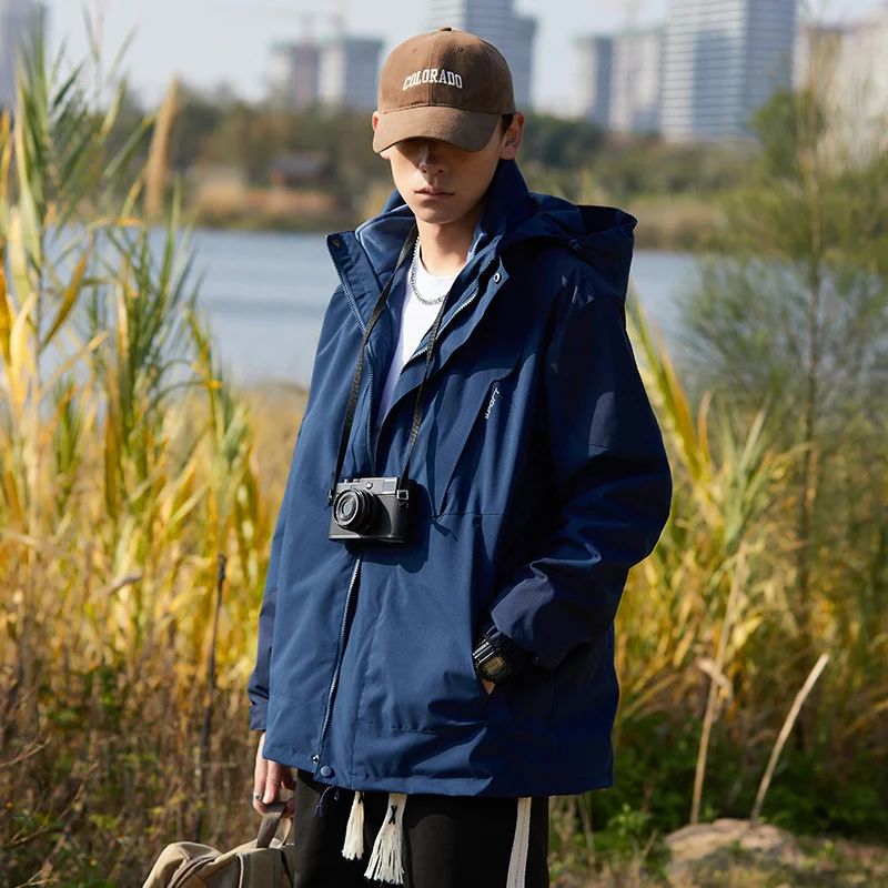 Damen zweilagige wasserabweisende Outdoorjacke mit Kapuze, Taillenregulierung und Kontrastbesätzen Drune