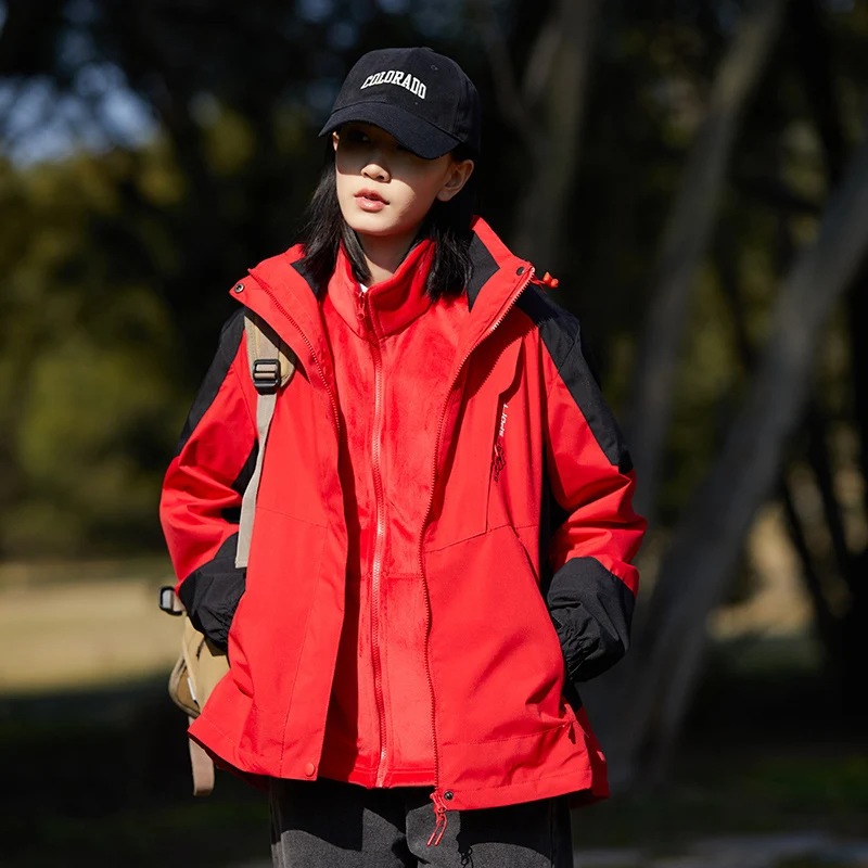 Damen zweilagige wasserabweisende Outdoorjacke mit Kapuze, Taillenregulierung und Kontrastbesätzen Drune