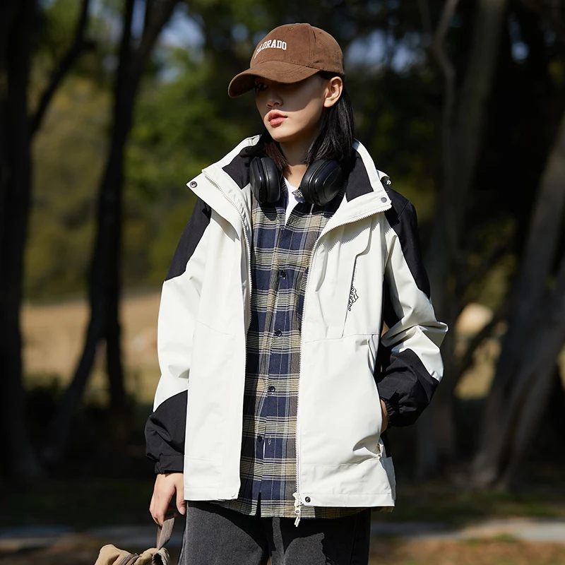 Damen zweilagige wasserabweisende Outdoorjacke mit Kapuze, Taillenregulierung und Kontrastbesätzen Drune