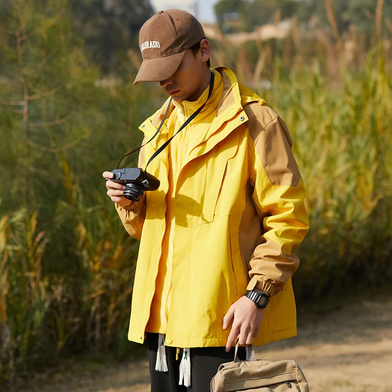 Damen zweilagige wasserabweisende Outdoorjacke mit Kapuze, Taillenregulierung und Kontrastbesätzen Drune