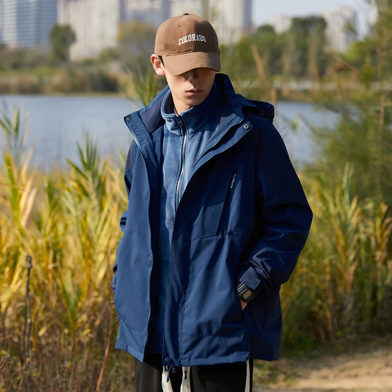 Damen zweilagige wasserabweisende Outdoorjacke mit Kapuze, Taillenregulierung und Kontrastbesätzen Drune