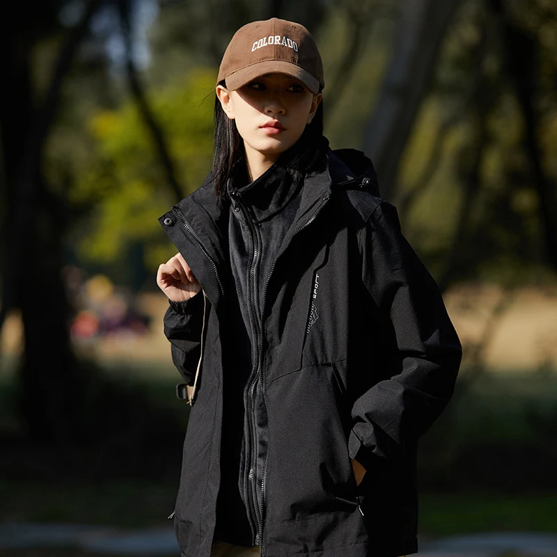 Damen zweilagige wasserabweisende Outdoorjacke mit Kapuze, Taillenregulierung und Kontrastbesätzen Drune