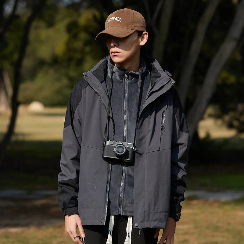 Damen zweilagige wasserabweisende Outdoorjacke mit Kapuze, Taillenregulierung und Kontrastbesätzen Drune