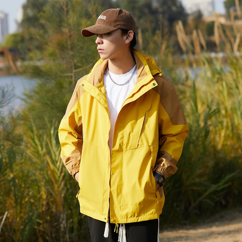 Damen zweilagige wasserabweisende Outdoorjacke mit Kapuze, Taillenregulierung und Kontrastbesätzen Drune