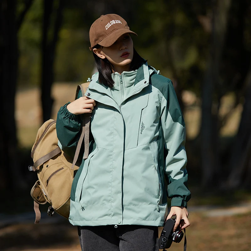 Damen zweilagige wasserabweisende Outdoorjacke mit Kapuze, Taillenregulierung und Kontrastbesätzen Drune