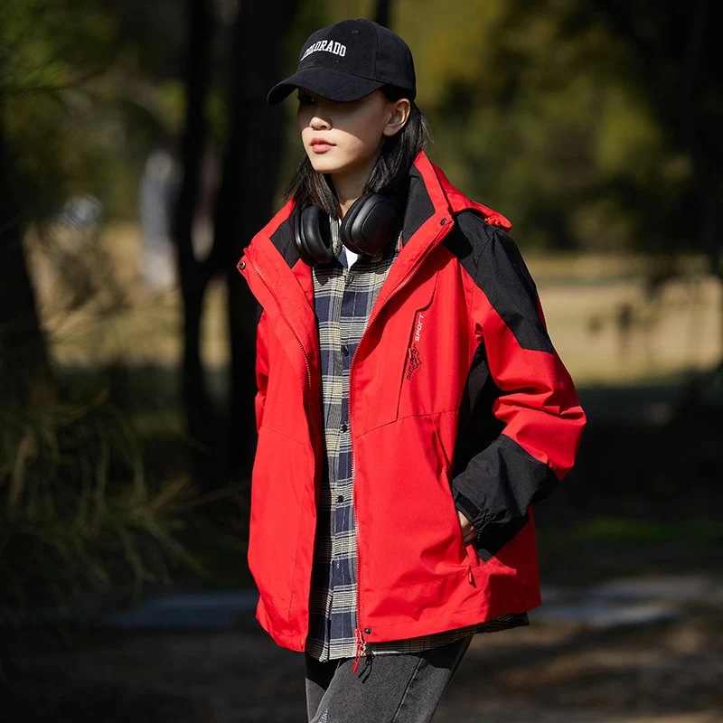 Damen zweilagige wasserabweisende Outdoorjacke mit Kapuze, Taillenregulierung und Kontrastbesätzen Drune