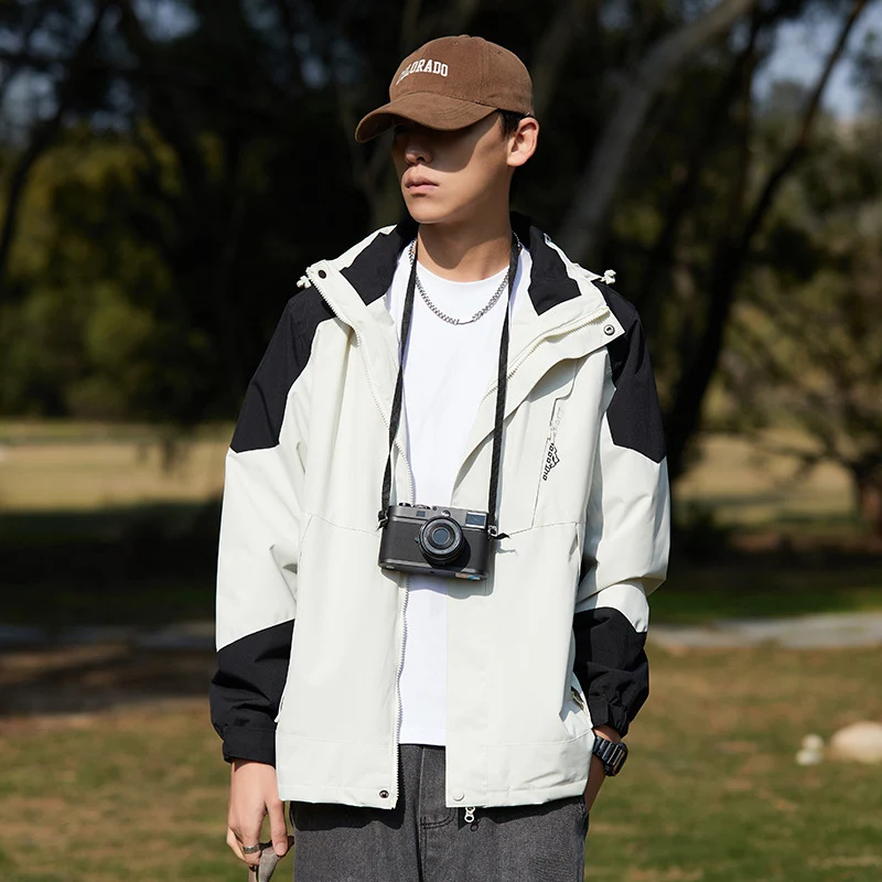 Damen zweilagige wasserabweisende Outdoorjacke mit Kapuze, Taillenregulierung und Kontrastbesätzen Drune