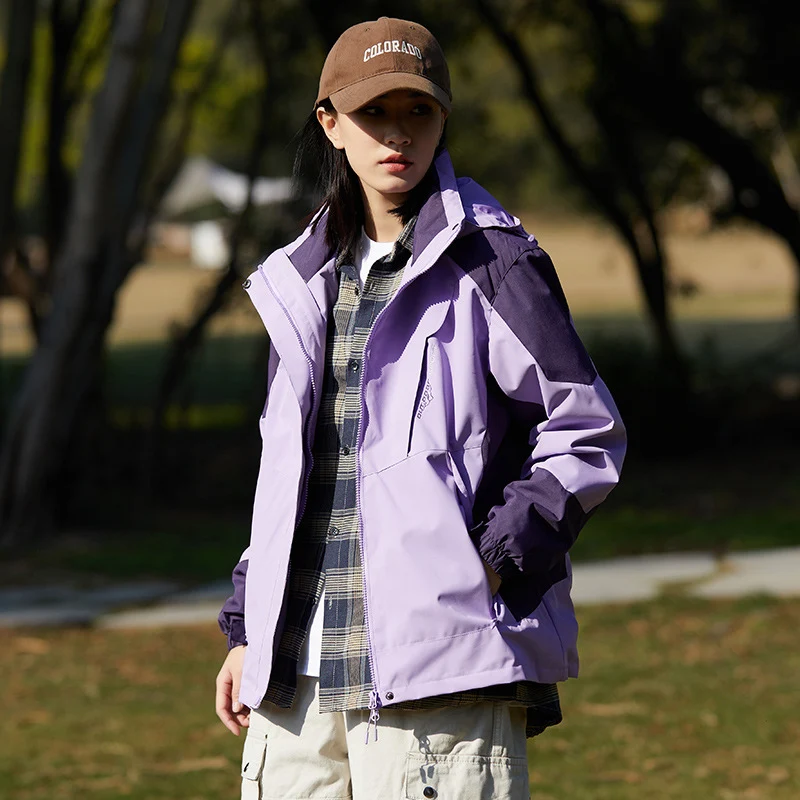 Damen zweilagige wasserabweisende Outdoorjacke mit Kapuze, Taillenregulierung und Kontrastbesätzen Drune