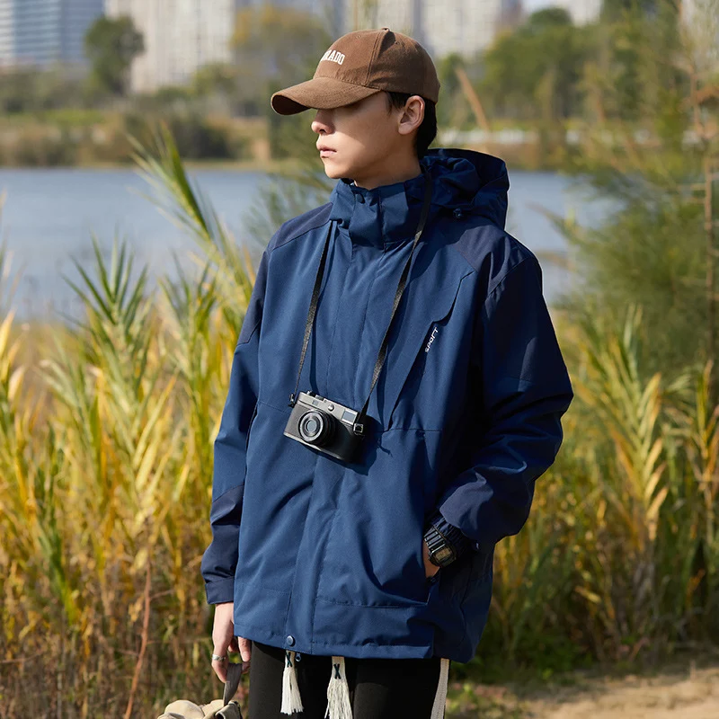 Damen zweilagige wasserabweisende Outdoorjacke mit Kapuze, Taillenregulierung und Kontrastbesätzen Drune