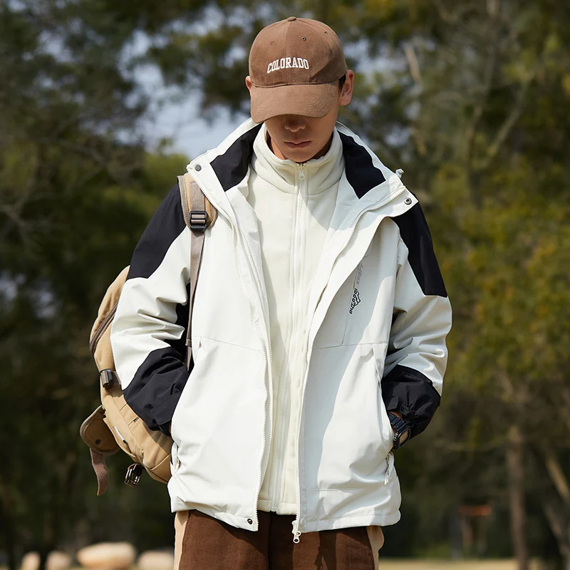 Damen zweilagige wasserabweisende Outdoorjacke mit Kapuze, Taillenregulierung und Kontrastbesätzen Drune