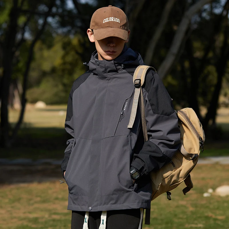 Damen zweilagige wasserabweisende Outdoorjacke mit Kapuze, Taillenregulierung und Kontrastbesätzen Drune