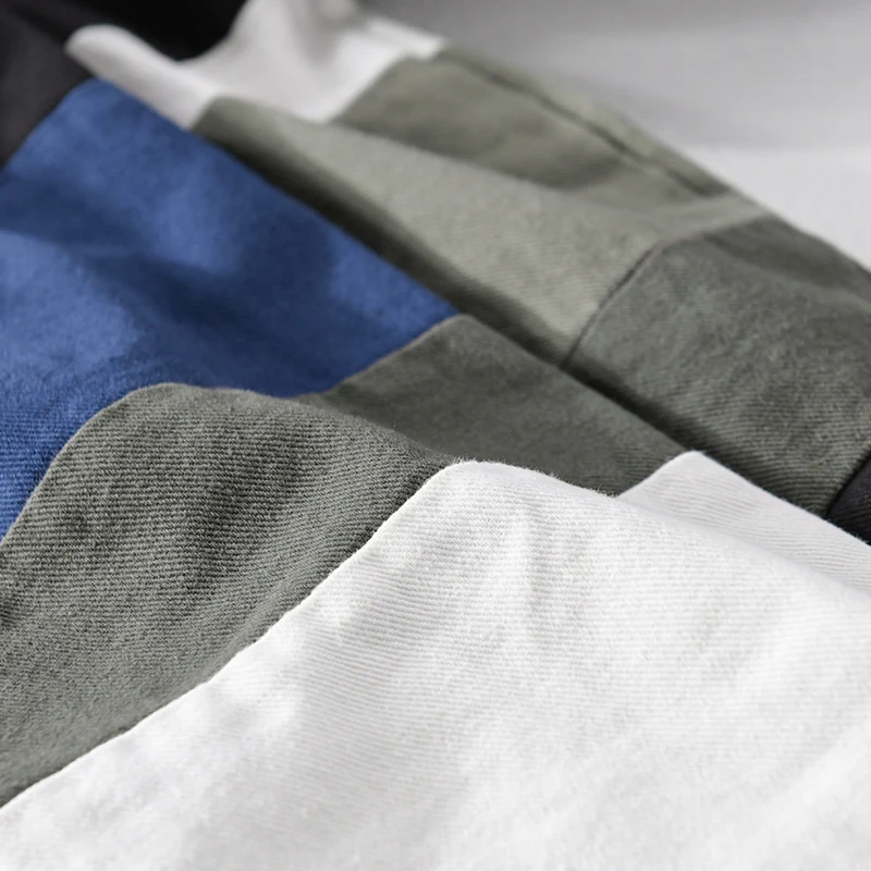 Herren Baumwoll-Overshirt im Layering-Stil mit geometrischen Colorblock-Einsätzen und Druckknopf-Leiste Drune