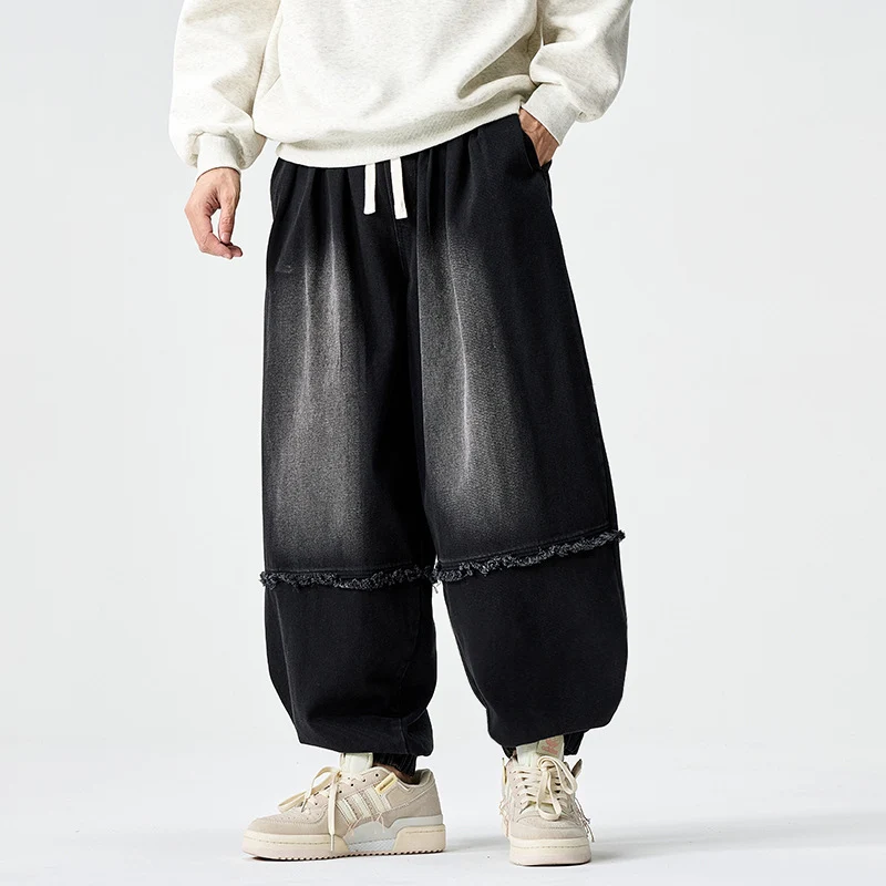 Herren Weit geschnittene Baggy-Denim-Hose mit Tunnelzug, elastischen Beinabschlüssen und Fransen-Detail Drune