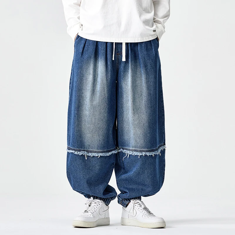 Herren Weit geschnittene Baggy-Denim-Hose mit Tunnelzug, elastischen Beinabschlüssen und Fransen-Detail Drune
