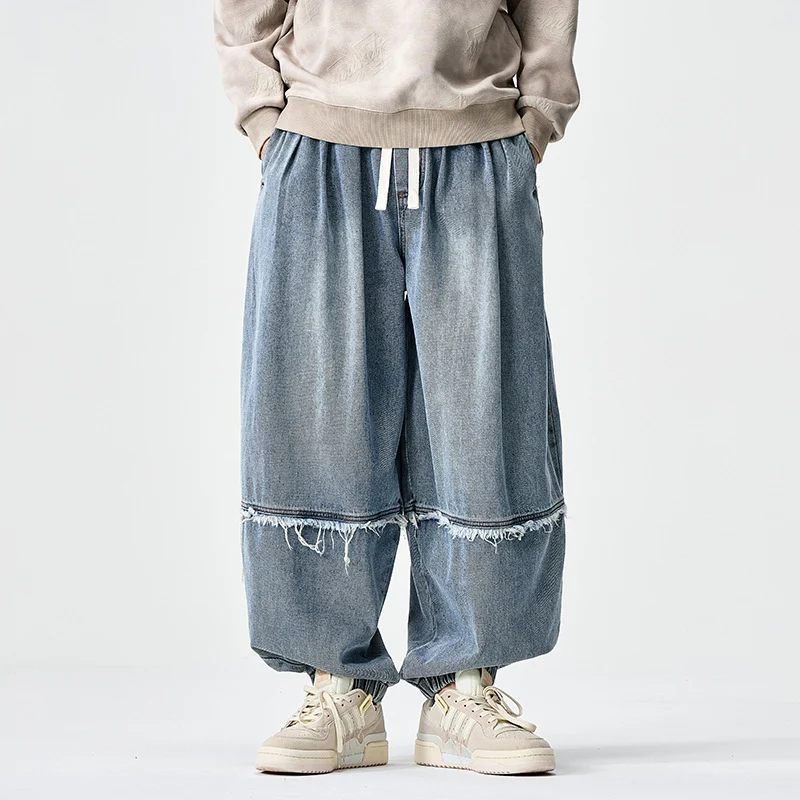 Herren Weit geschnittene Baggy-Denim-Hose mit Tunnelzug, elastischen Beinabschlüssen und Fransen-Detail Drune