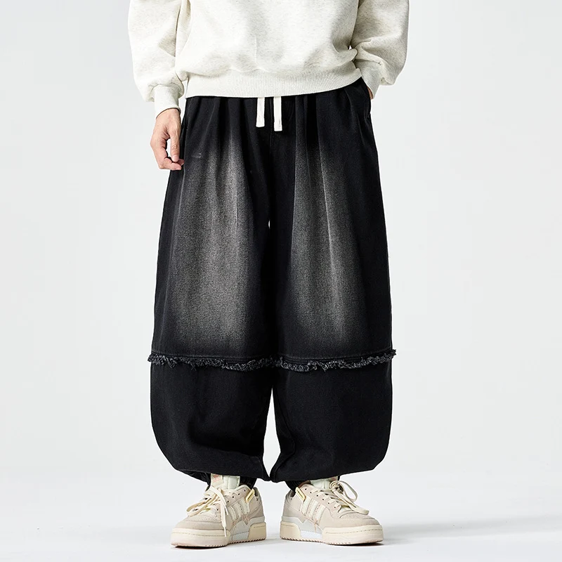Herren Weit geschnittene Baggy-Denim-Hose mit Tunnelzug, elastischen Beinabschlüssen und Fransen-Detail Drune