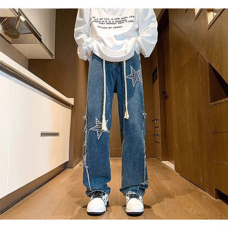 Damen Weite High‑Waist Denimhose mit Stern‑Applikationen, Fransen‑Seitenschlitzen und Kordelbund Drune