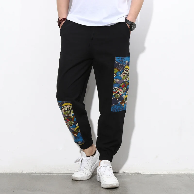 Herren Jogginghose mit seitlichen Panel-Prints, Tunnelzug und gerippten Bündchen Drune