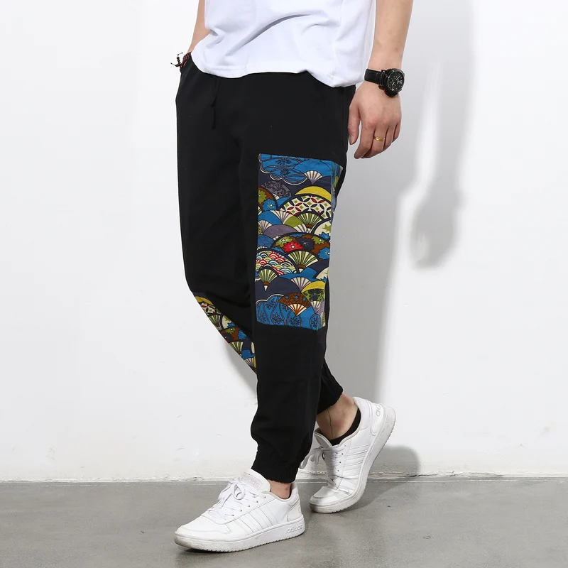 Herren Jogginghose mit seitlichen Panel-Prints, Tunnelzug und gerippten Bündchen Drune