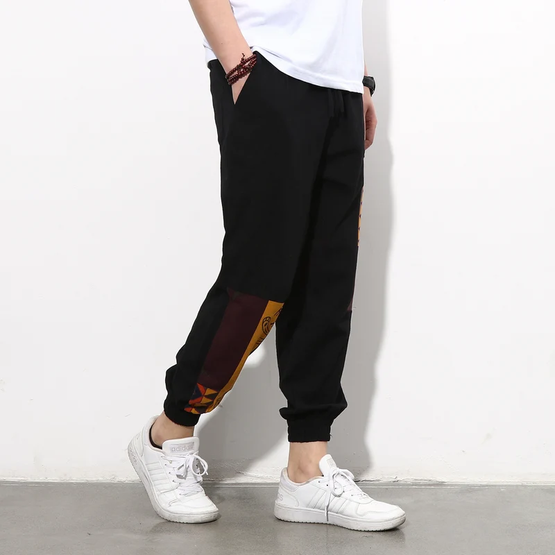 Herren Jogginghose mit seitlichen Panel-Prints, Tunnelzug und gerippten Bündchen Drune