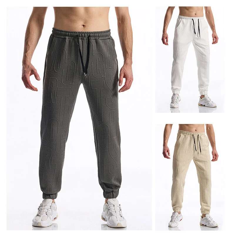 Herren Jogginghose mit elastischem Bund, Tunnelzug und geprägtem Allover‑Logo‑Relief Drune