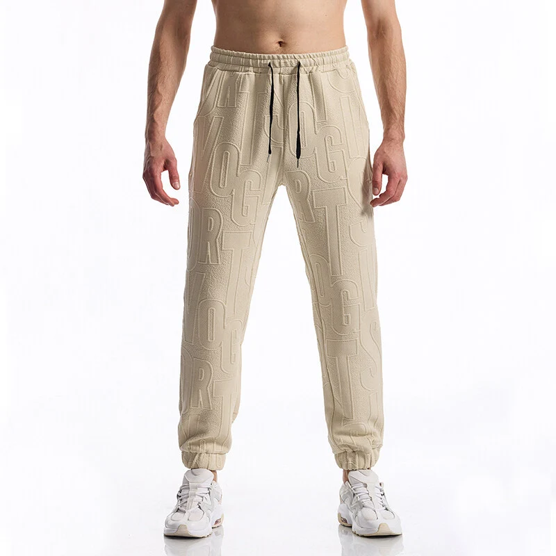 Herren Jogginghose mit elastischem Bund, Tunnelzug und geprägtem Allover‑Logo‑Relief Drune