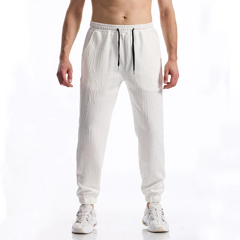 Herren Jogginghose mit elastischem Bund, Tunnelzug und geprägtem Allover‑Logo‑Relief Drune