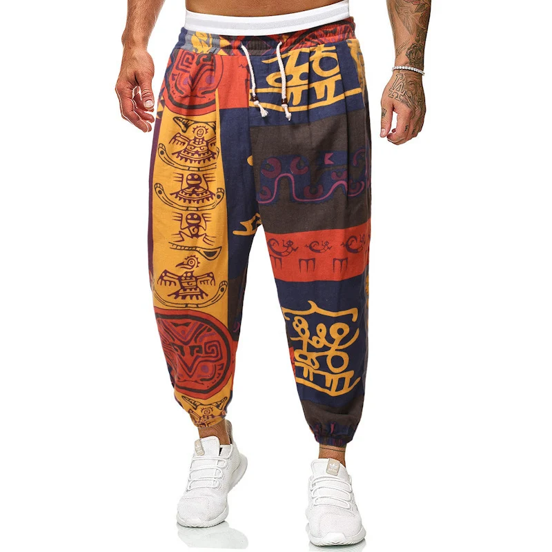 Herren Locker sitzende Patchwork-Loungehose mit Tunnelzug, elastischen Knöcheln und dekorativem Allover-Print Drune