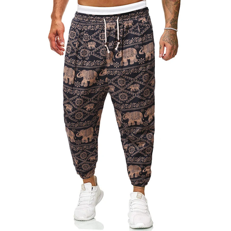 Herren Locker sitzende Patchwork-Loungehose mit Tunnelzug, elastischen Knöcheln und dekorativem Allover-Print Drune
