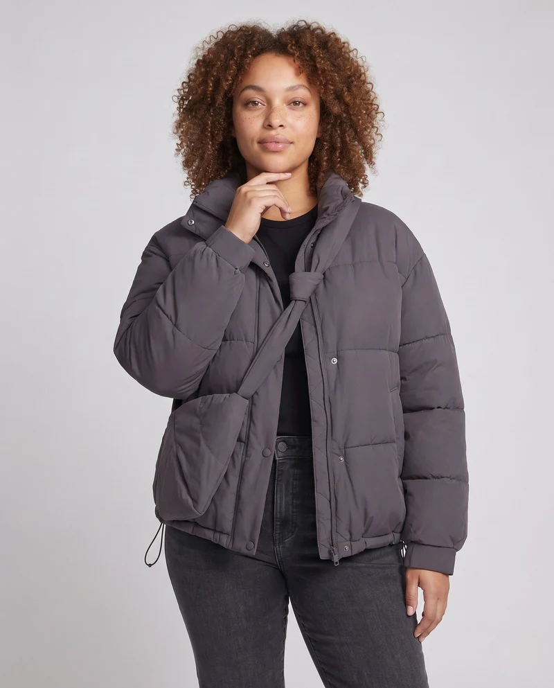 Damen Oversized gepolsterte Pufferjacke mit hohem Stehkragen und integrierter Schultertasche
