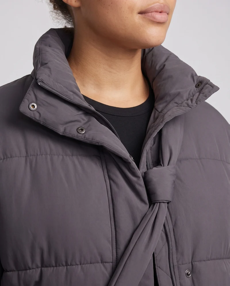 Damen Oversized gepolsterte Pufferjacke mit hohem Stehkragen und integrierter Schultertasche