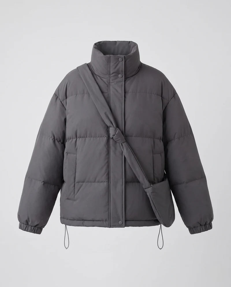 Damen Oversized gepolsterte Pufferjacke mit hohem Stehkragen und integrierter Schultertasche