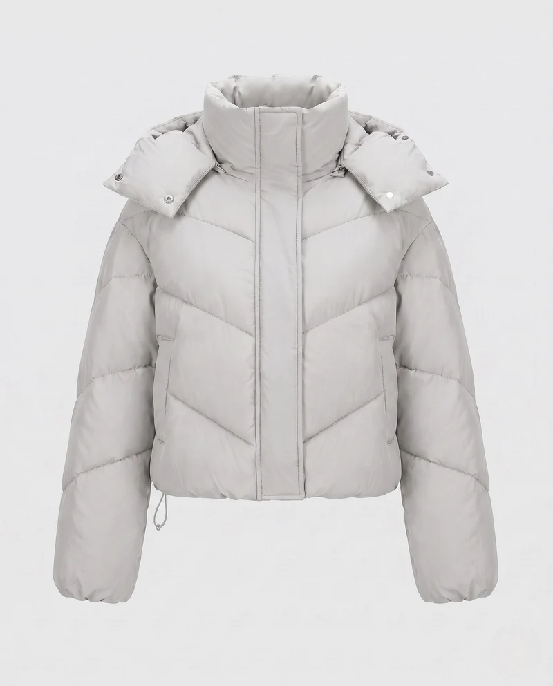 Damen cropped gesteppte Jacke mit hohem Schalkragen, asymmetrischer Zickzack-Steppung und verstellbarem Kordelzugbund.