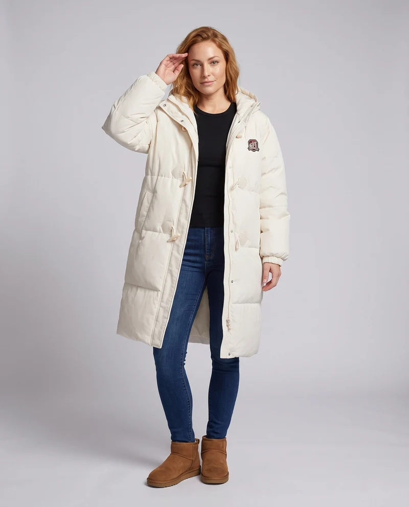 Damen langgeschnittene thermische Pufferjacke mit minimalistischer Knopfleiste, ergonomischem Stehkragen und geräumigen Seitentaschen