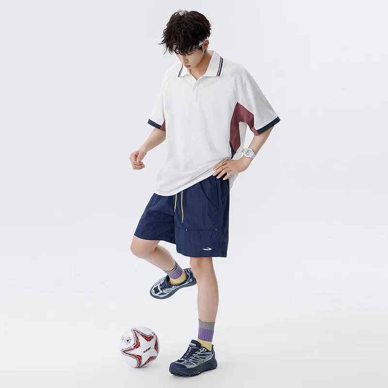 Unisex Boxy Oversize Polo-Shirt aus technischem Funktionsjersey mit Kontrastpaneelen und Raglanärmeln Drune